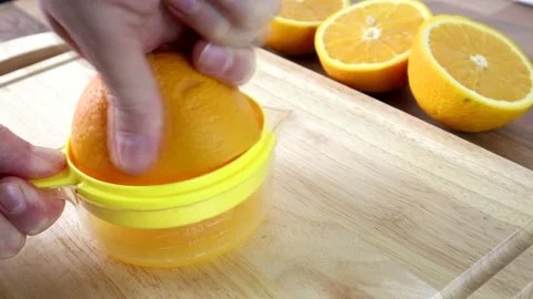Squeezing An Orange To Make Freshly Squeezed Orange Juice 스톡 동영상 134175615
