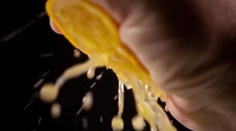Squeezing orange, slow motion Stock Footage 55550463