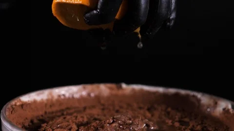 Squeezing orange, slow motion. Squeeze out the orange juice. Stock Footage 86607863