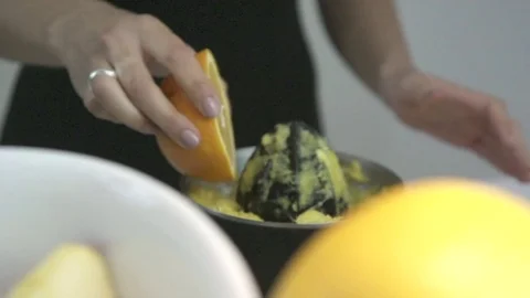 Squeezing oranges - juicer, squeezer Stock Footage 72269091