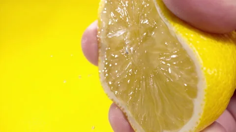 Squeezing out fresh Lemon juice drains from the pulp Super slow-mo 1000 fps 動画素材 163962692