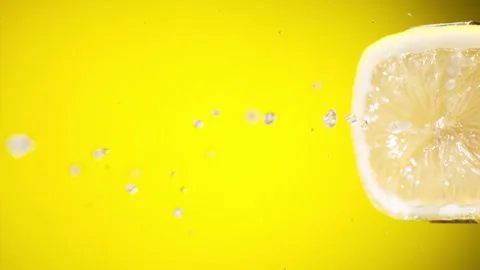 Squeezing out fresh Lemon juice drains from the pulp Super slow-mo 1000 fps Stock Footage 276731931
