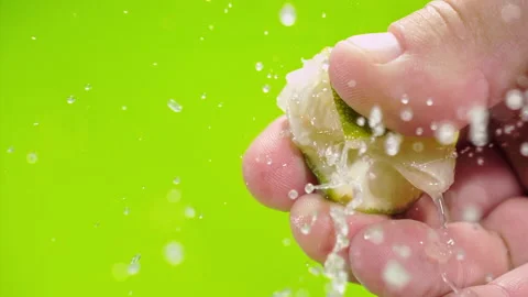 Squeezing out fresh Lime juice drains from the pulp Super slow-mo 1000 fps Stock Footage 163963261