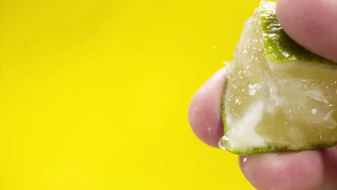 Squeezing out fresh orange juice drains from the pulp Super slow-mo 1000 fps Stock Footage 163962338