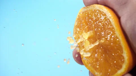 Squeezing out fresh orange juice drains from the pulp Super slow-mo 1000 fps 動画素材 163963502