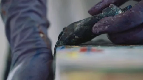 Squeezing Paint out of a Tube Stock Footage 76131496