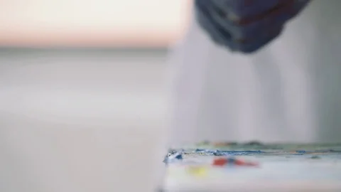 Squeezing Paint out of a Tube Stock Footage 76131546