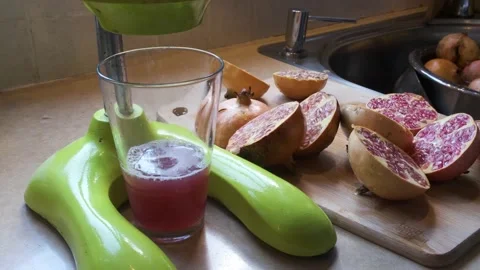 Squeezing Pomegranate Juice Stock Footage 164623013