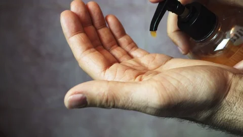 Squeezing soap onto a palm. Macro, close-up 4k Stock Footage 104397700