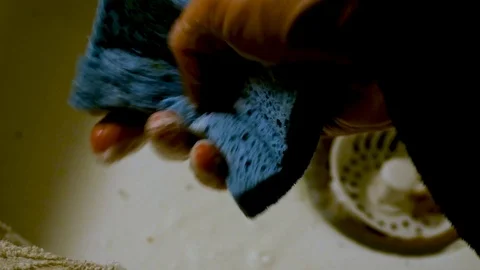 Squeezing Soapy Sponge Stock Footage 85823400