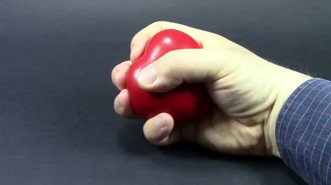Squeezing a spongy red heart Video stock 62771126
