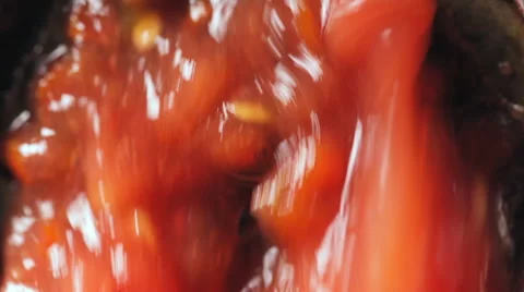 Squeezing tomato juice. Red tomatoes. Video stock 67578403