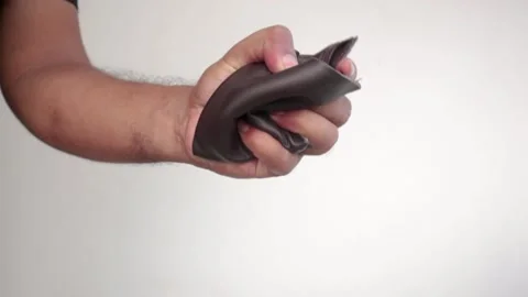 Squeezing wallet with anger and frustration by a male hand. Stock Footage 154425124