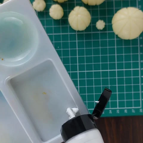 Squeezing white acrylic paint onto palette for DIY pumpkin craft. Stock Footage 346277159