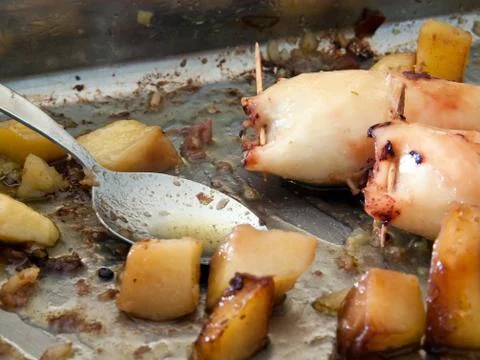 Squid and potatoes Stock Photos
