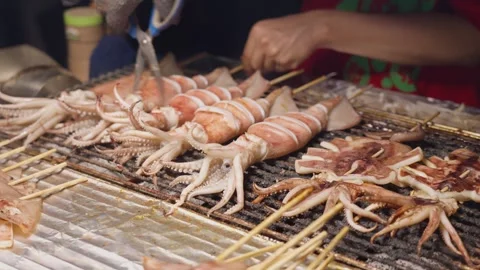 Squid BBQ is cooked and served at night market at Taipei, Taiwan - 4k Stock-Footage 295235216