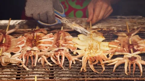 Squid BBQ is cooked and served at night street market, Taipei, Taiwan - 4k Stock Footage 295516288