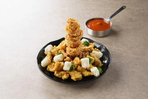 Squid Chicken service queue through with chili sauce Stock Photos