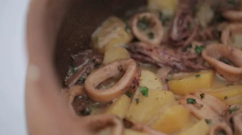Squid cooked in a clay pot. Close up. HD shot with slider Stock Footage 39910145