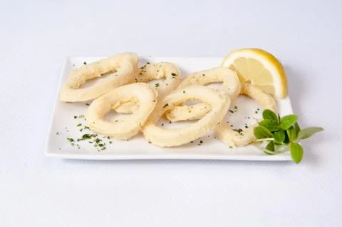 Squid dish on a white background Stock Photos