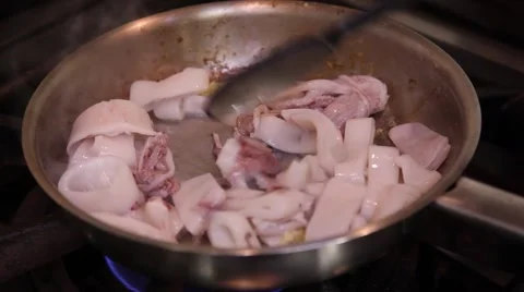 Squid frying in a pan Stock Footage 46531775