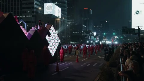 'Squid Game' parade float with LED screens of contestants' faces in Seoul at Stock Footage 312319930