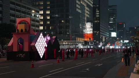 'Squid Game' parade float with staircase architecture and LED masks in Seoul at Stock Footage 312319928