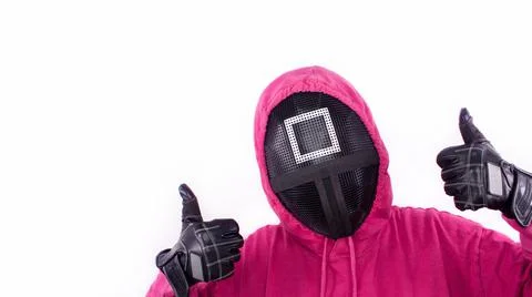 Squid Game red guard with thumbs up sign on white background. Space for text. Stock Photos
