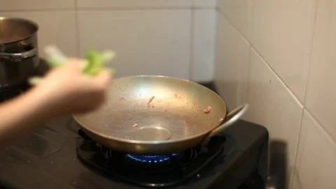 Squid, green vegetable, onions stir-fried in a pan for healthy food Stock Footage 75514261