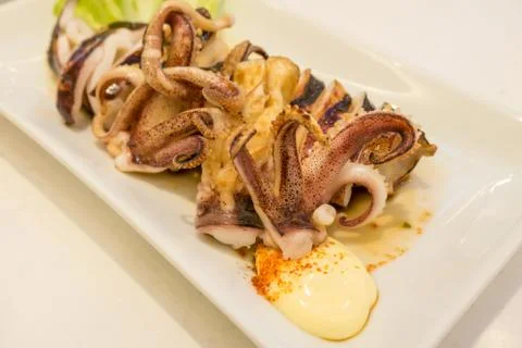 Squid grill on white dish Stock Photos