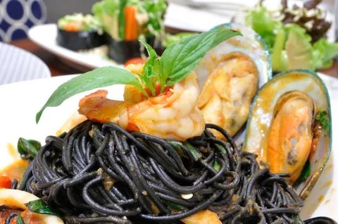 Squid ink-Spaghetti squid ink with seafood Stock Photos