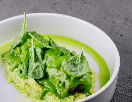 Squid with mashed avocado on stone Stock Photos