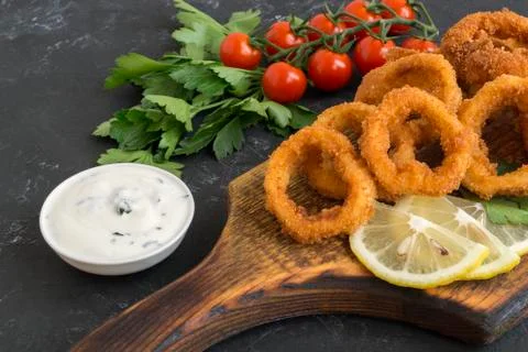 Squid rings deep fried with crispy crust. Stock Photos