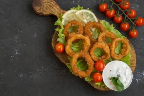 Squid rings deep fried with crispy crust. Stock Photos