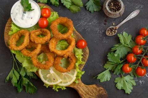 Squid rings deep fried with crispy crust. Stock Photos
