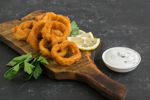 Squid rings deep fried with crispy crust. Stock Photos