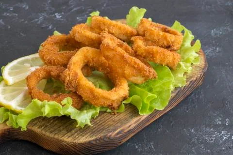 Squid rings deep fried with crispy crust. Stock Photos