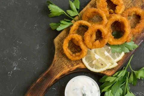 Squid rings deep fried with crispy crust. Stock Photos