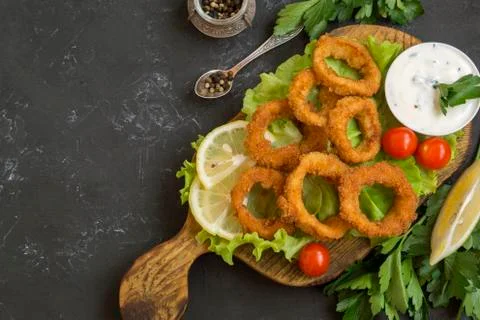 Squid rings deep fried with crispy crust. Stock Photos