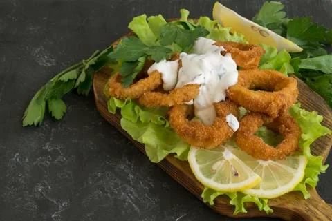 Squid rings deep fried with crispy crust. Stock Photos