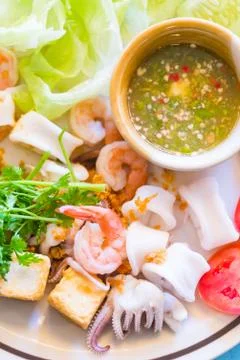 Squid shrimp tofu boiled with vegetable on dish Stock Photos