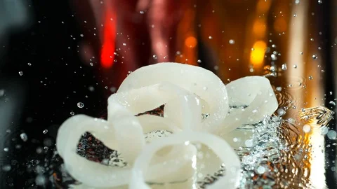 Squid slices fall on a wet table in the water in SLOW MOTION , 4k, phantom flex Stock Footage 114968094