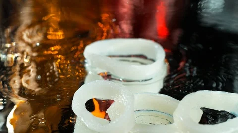 Squid slices fall on a wet table in the water in SLOW MOTION , 4k, phantom flex Stock Footage 114968191