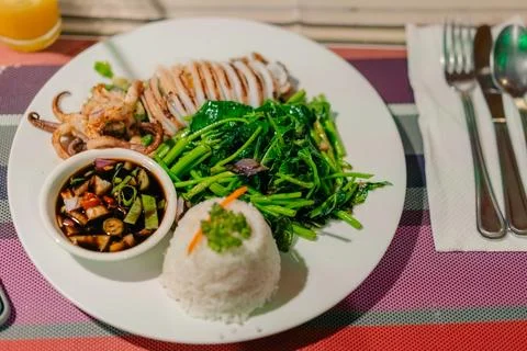 Squid stuffed with stewed vegetables Stock Photos