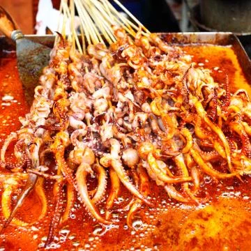 Squid's tentacles skewers Stock Photos