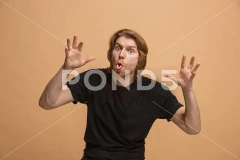 The squint eyed man with weird expression isolated on pastel Stock Photos