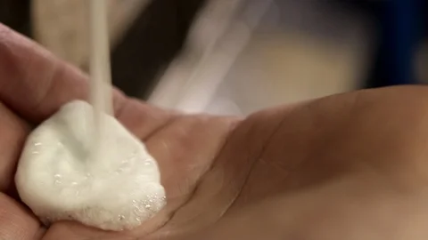 Squiring soap into hand, slow motion Stock Footage 129294620