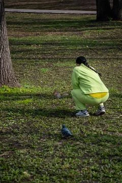 Squirrel after winter feeds on nuts Stock Photos