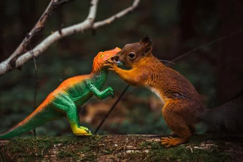 Squirrel and dinosaur Stock Photos