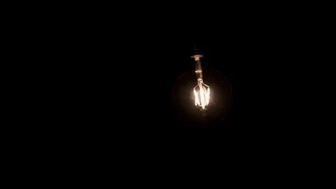 Squirrel cage filament light bulb, retro style glow bright globe moving Stock Footage 89194759